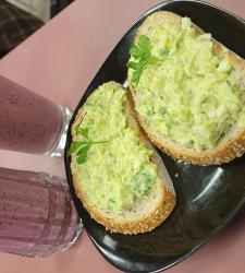 Egg salad on bread on a plate